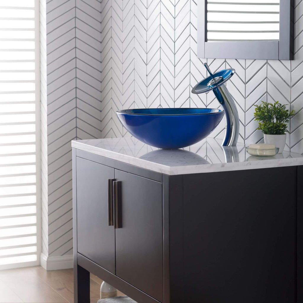 Picture of a beautiful sink faucet in blue color as an inspiration for bathroom renovation practical ideas.