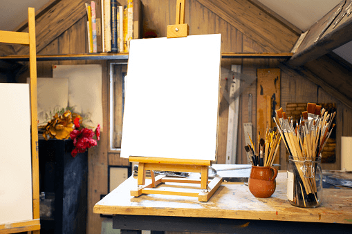 a blank wooden canvas set up in a beautiful environment ready to be painted